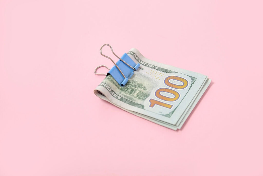 $100 bill with clip for article best ways to make $4,000 a month